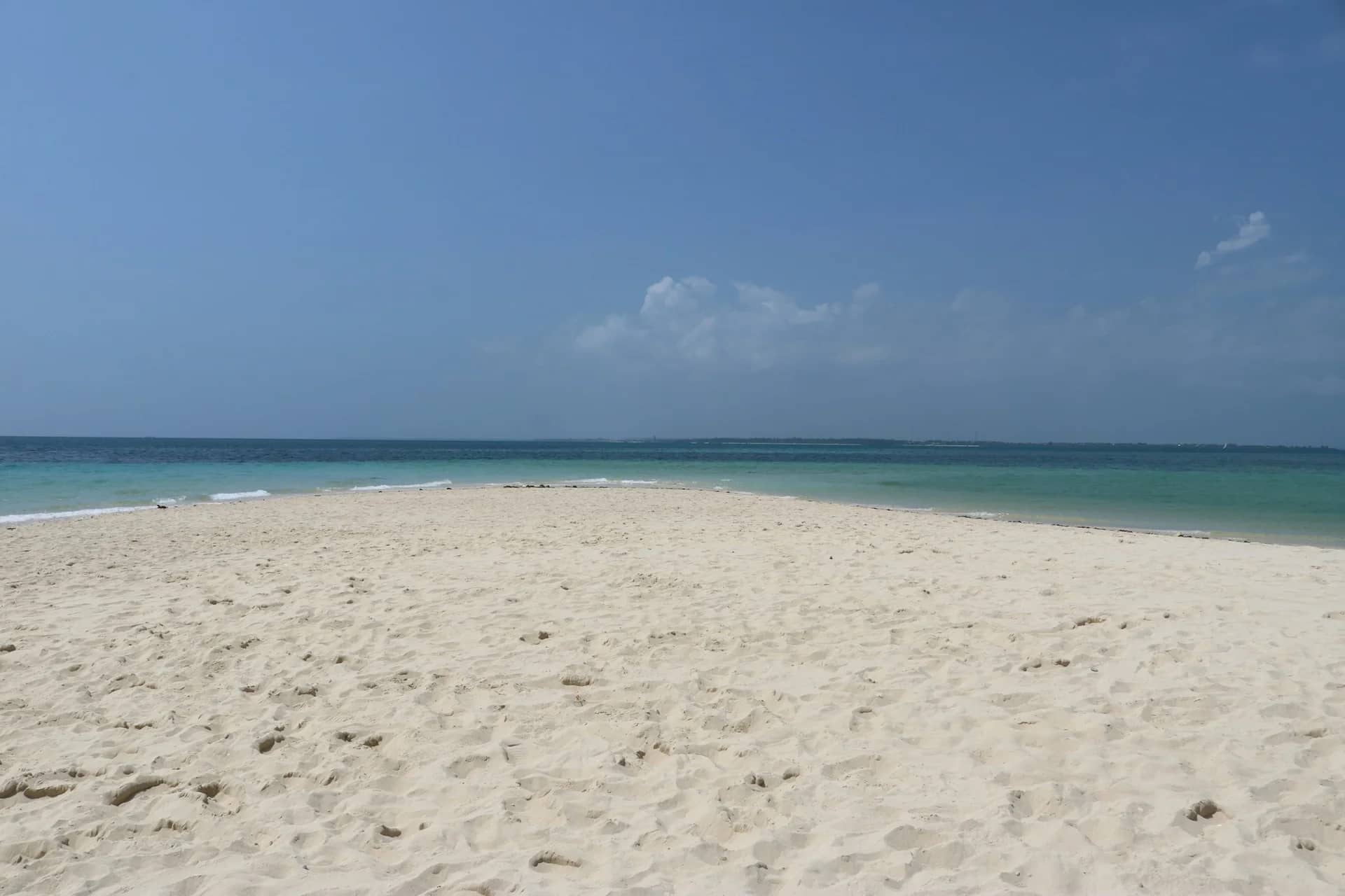 White sand and turquoise water on an empty Zanzibar beach